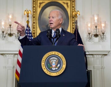 President Joe Biden speaks at the podium