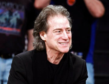 File photo: Comedian Richard Lewis attends an NBA basketball game in Los Angeles on Dec. 25, 2012. Lewis, an acclaimed comedian known for exploring his neuroses in frantic, stream-of-consciousness diatribes while dressed in all-black, leading to his nickname ''The Prince of Pain,'' has died. He was 76. He died at his home in Los Angeles on Tuesday night after suffering a heart attack, according to his publicist Jeff Abraham.