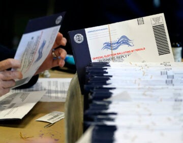 File photo: Chester County, Pa. election workers process mail-in and absentee ballots at West Chester University in West Chester on Nov. 4, 2020.