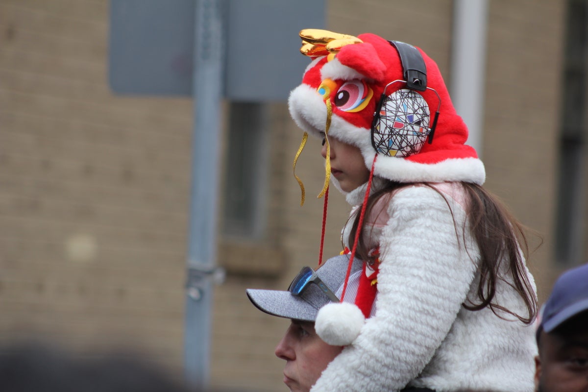 Generations of Philadelphians flocked to Chinatown for the Lunar New Year Parade on Feb. 11, 2024. (Cory Sharber/WHYY)