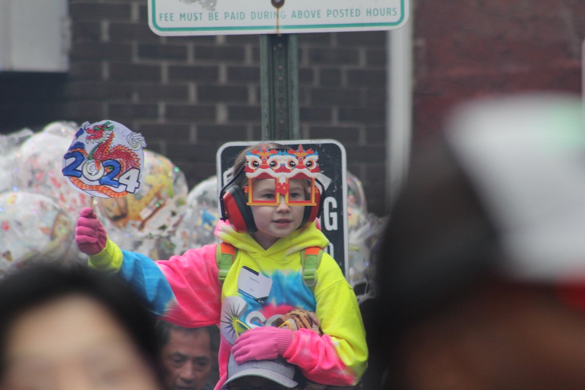 Generations of Philadelphians flocked to Chinatown for the Lunar New Year Parade on Feb. 11, 2024. (Cory Sharber/WHYY)