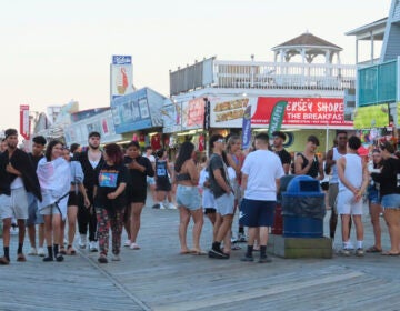 People on the boardwalk at the Jersey Shore