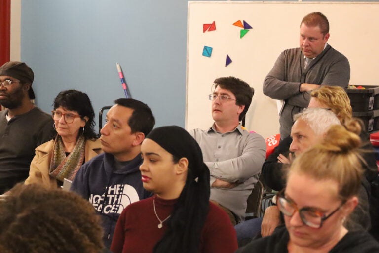 Audience members listen at Bridging Blocks community discussion