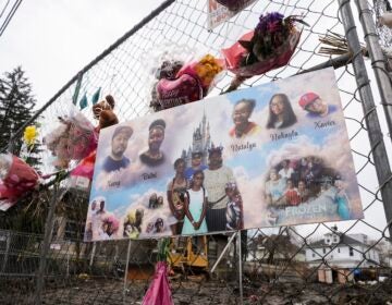 A makeshift memorial at the scene of a shooting and house fire that killed six members of an extended family in East Lansdowne, Pa., Wednesday, Feb. 28, 2024.