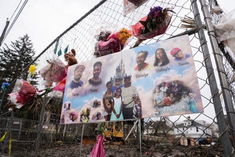 A makeshift memorial at the scene of a shooting and house fire that killed six members of an extended family in East Lansdowne, Pa., Wednesday, Feb. 28, 2024.
