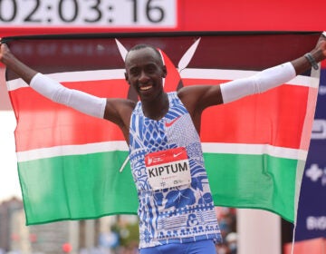 Kelvin Kiptum of Kenya celebrates after winning the 2023 Chicago Marathon professional men's division and setting a world record marathon time of 2:00:35 at Grant Park on Oct. 8, 2023, in Chicago.