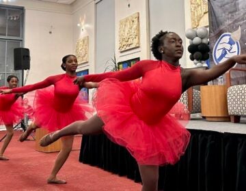 Three ballet dancers perform at the event.
