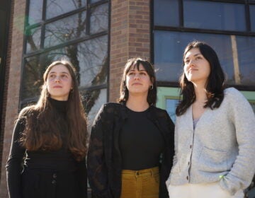 Evie Gentile, Sophie Cloarec and Christina Higashi-Howard pose for a photo together outside of a building
