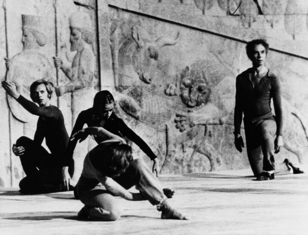 Performing at Shiraz Art Festival, Persepolis Event, are dancers Douglas Dunn (left), Carolyn Brown (rear) and Merce Cunningham (far right).
