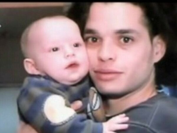 The author as a baby held by his dad.