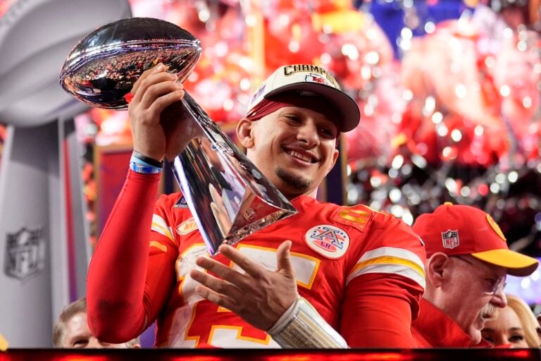 Kansas City Chiefs quarterback Patrick Mahomes celebrates with the trophy after the team's win in overtime during the NFL Super Bowl 58 football game against the San Francisco 49ers on Sunday, Feb. 11, 2024, in Las Vegas. The Chiefs won 25-22.