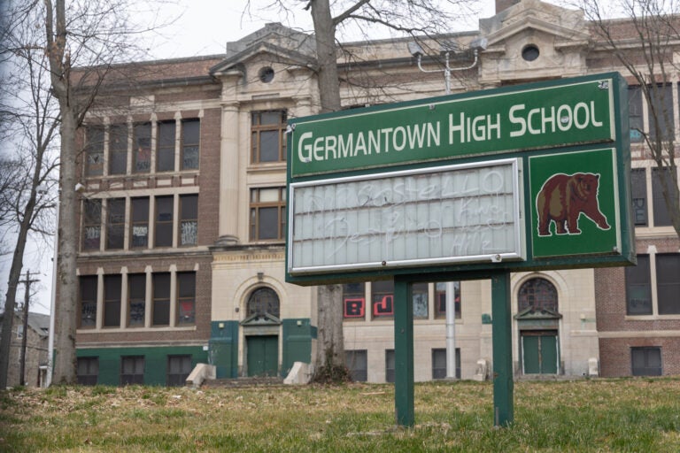 A sign in front of a former school building reads Germantown High School