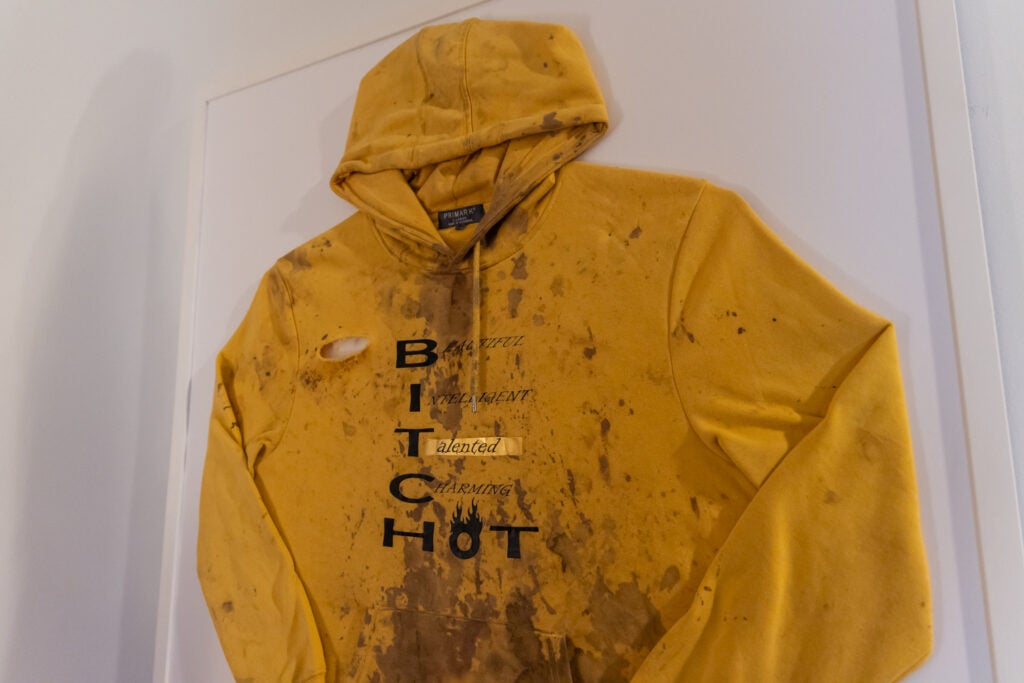 A sweatshirt after an assault is on display