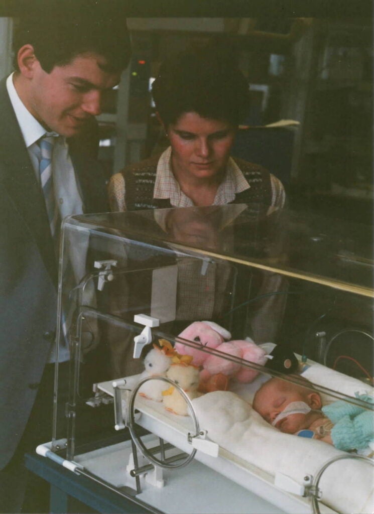 John and Karen Ottaway visiting their daughter Sophie at two days old. (Courtesy of Sophie Ottaway)