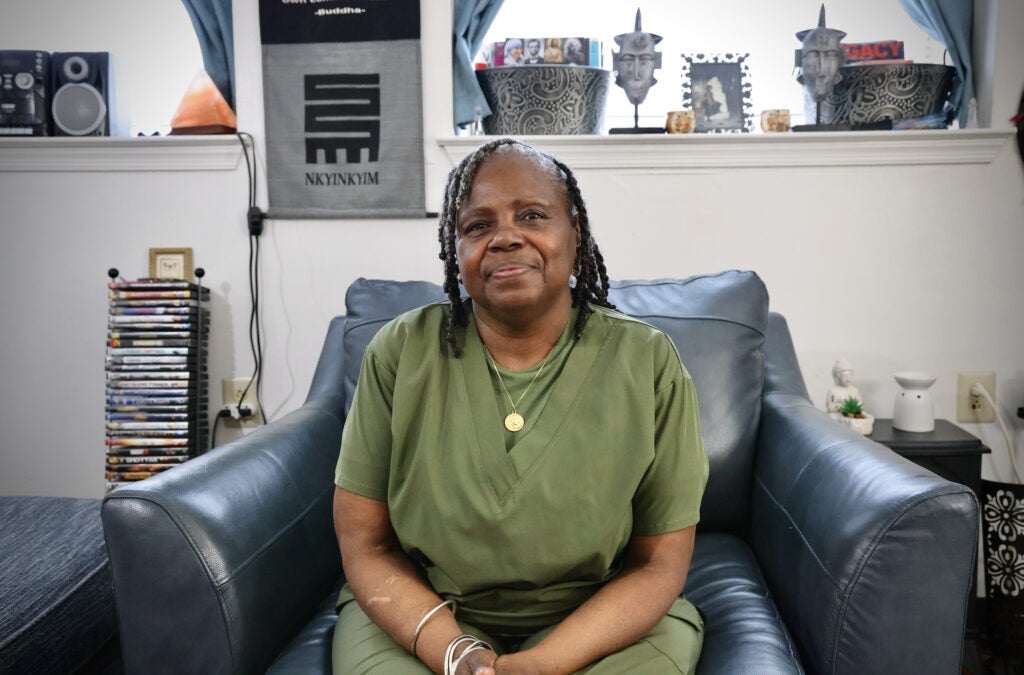 June Burris poses for a photo in an armchair.