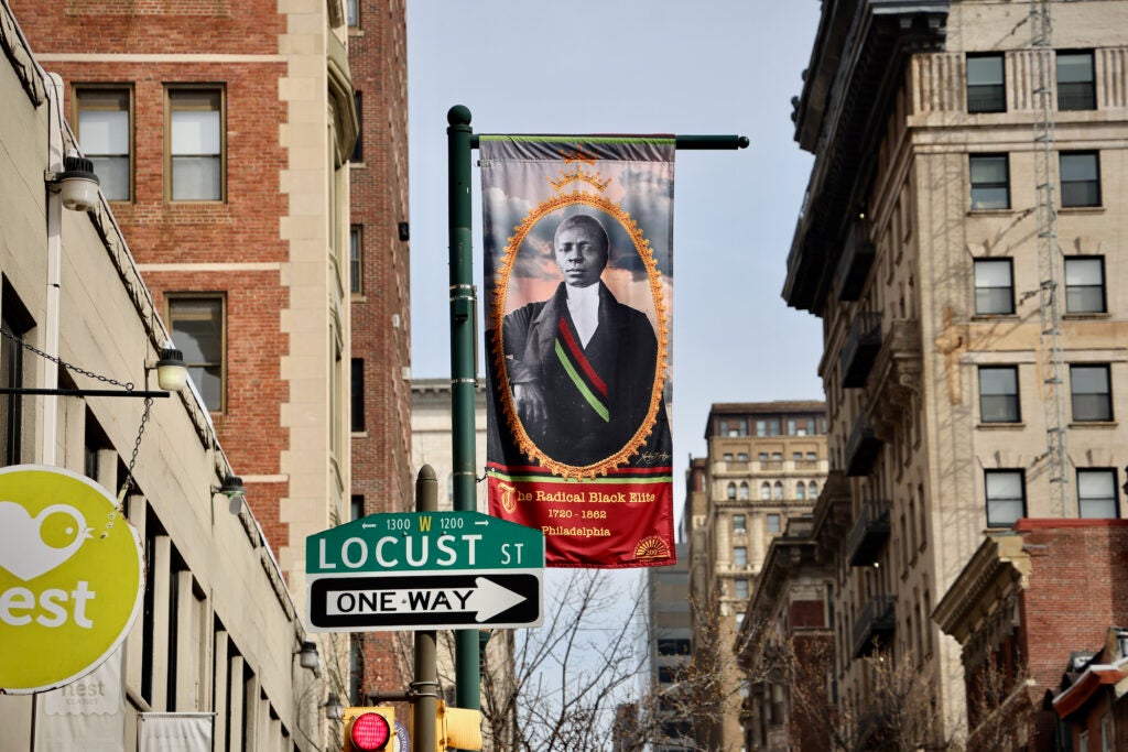 A banner designed by Xenobia Bailey hangs at the corner of 13th and Locust streets