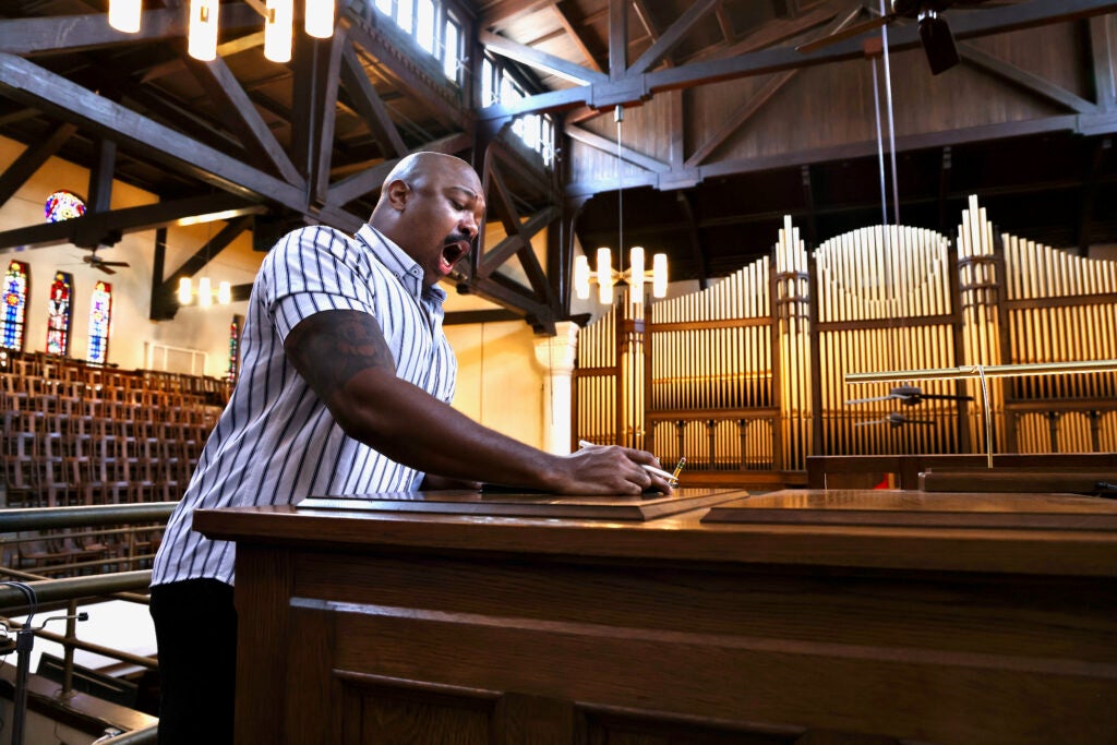 Singer Brenton Maddox rehearses for his performance at Tindley Temple