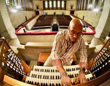 Paul Eaton, chair of fine arts at Girard College, plays the organ in the college chapel.