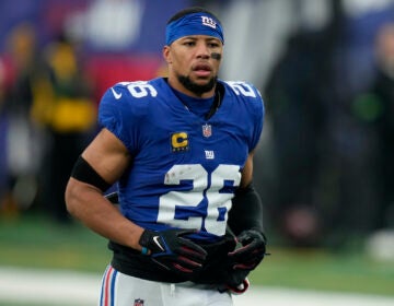 New York Giants running back Saquon Barkley (26) warms up before playing against the Philadelphia Eagles in an NFL football game, Sunday, Jan. 7, 2024, in East Rutherford, N.J. (AP Photo/Seth Wenig)