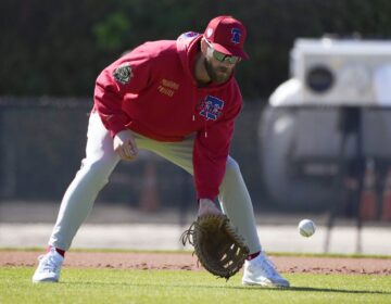 Philadelphia Phillies first baseman Bryce Harper fields a ground ball during a baseball spring training workout Monday, Feb. 19, 2024, in Clearwater, Fla.