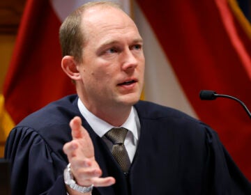 Fulton County Superior Judge Scott McAfee presides in court, Friday, March, 1, 2024, in Atlanta. The hearing is to determine whether Fulton County District Attorney Fani Willis should be removed from the case because of a relationship with Nathan Wade, special prosecutor she hired in the election interference case against former President Donald Trump. (AP Photo/Alex Slitz, Pool)