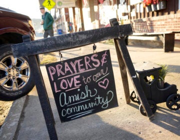 A sign reads Prays and love to the Amish community