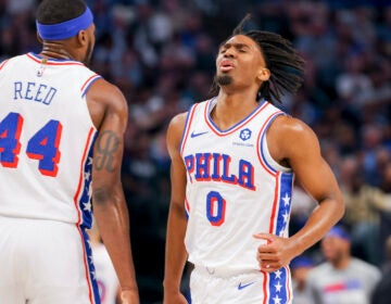 Philadelphia 76ers guard Tyrese Maxey (0) celebrates with forward Paul Reed (44) during the first half of an NBA basketball game against the Dallas Mavericks, Sunday, March 3, 2024, in Dallas.