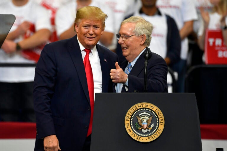 File photo: Then President Donald Trump (left) and Senate Minority Leader Mitch McConnell of Ky., greet each other during a campaign rally in Lexington, Ky., Nov. 4, 2019. McConnell has endorsed Donald Trump for president.
