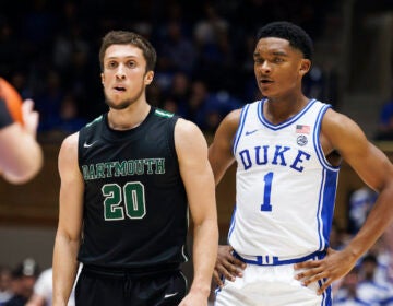 Dartmouth's Romeo Myrthil (20) stands next to Duke's Caleb Foster (1) during the second half of an NCAA college basketball game in Durham, N.C., Monday, Nov. 6, 2023. A ruling that gives the Dartmouth basketball team the right to unionize has far-reaching implications for all of college sports — from the quaint, academically oriented Ivy League to the big-money football factories like Michigan and Alabama. But it’s not time to cut down the nets just yet.