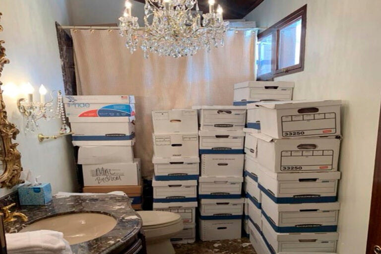 This image, contained in the indictment against former President Donald Trump, shows boxes of records stored in a bathroom and shower in the Lake Room at Trump's Mar-a-Lago estate in Palm Beach, Fla. A federal judge is set to hear arguments on whether to dismiss the classified documents prosecution of Donald Trump. His lawyers say the former president was entitled under the Presidential Records Act to keep the sensitive documents with him when he left the White House and headed to Florida.