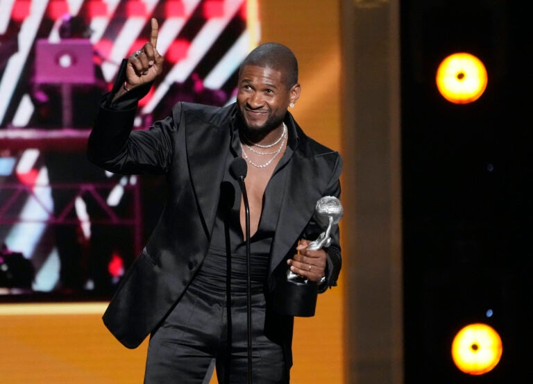 Usher addresses the audience after winning Entertainer of the Year during the 55th NAACP Image Awards, Saturday, March 16, 2024, at The Shrine Auditorium in Los Angeles.