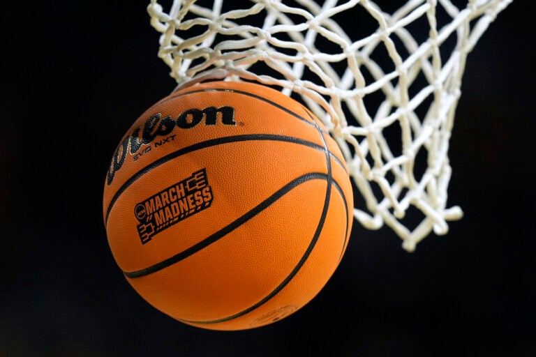 A ball goes through a basket before a second-round college basketball game between Iowa and West Virginia in the NCAA Tournament, Monday, March 25, 2024, in Iowa City, Iowa. (AP Photo/Charlie Neibergall)