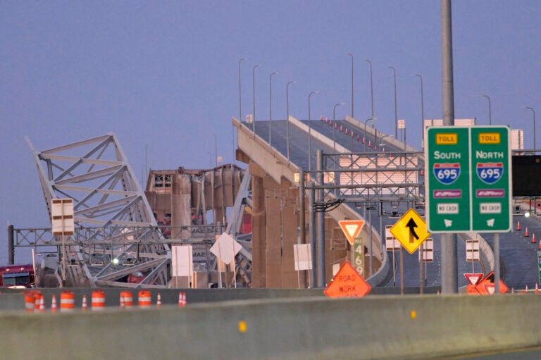 Parts of the Francis Scott Key Bridge remain after a container ship collided with a support Tuesday, March 26, 2024 in Baltimore. The major bridge in Baltimore snapped and collapsed after a container ship rammed into it early Tuesday, and several vehicles fell into the river below. Rescuers were searching for multiple people in the water.