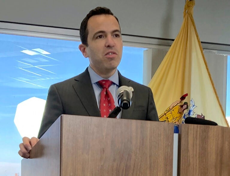 Matt Platkin speaking at a podium.