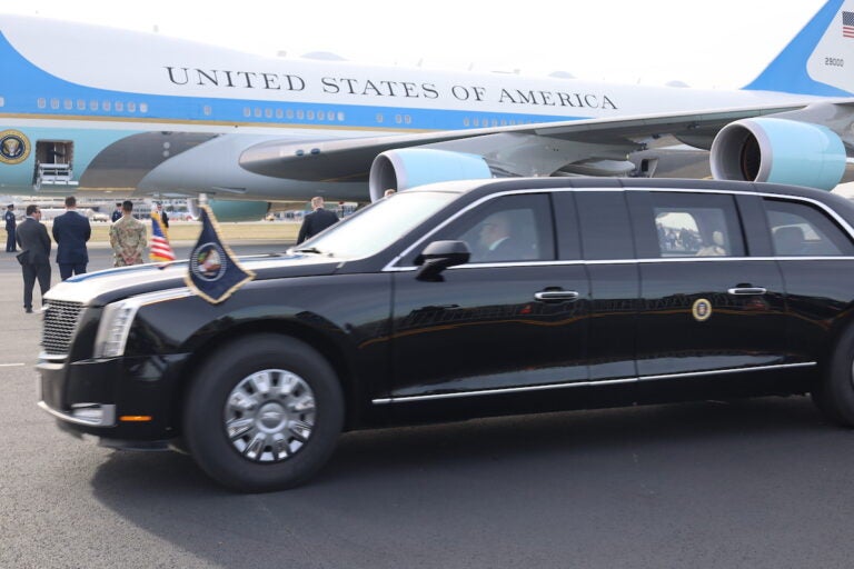 The presidential motorcade waits for the Bidens to exit Air Force One