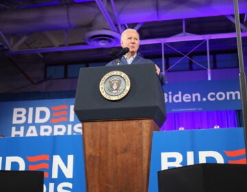 President Joe Biden speaks at a podium