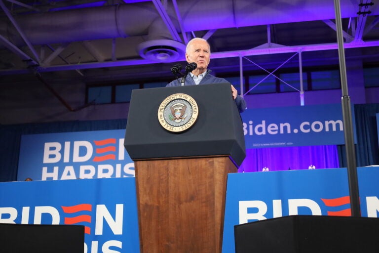 President Joe Biden speaks at a podium