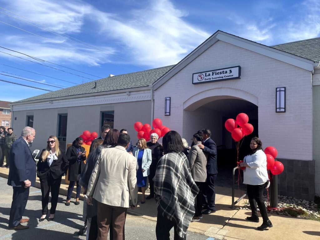 Maria Matos and the LACC staff celebrated the ribbon cutting for the grand opening of La Fiesta 3, a childcare center.