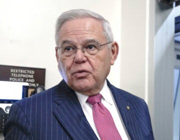 Bob Menendez standing in a hallway