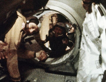 Astronaut Tom Stafford (left) and cosmonaut Alexey Leonov shake hands after the first docking of U.S. and Soviet spacecraft in 1975.