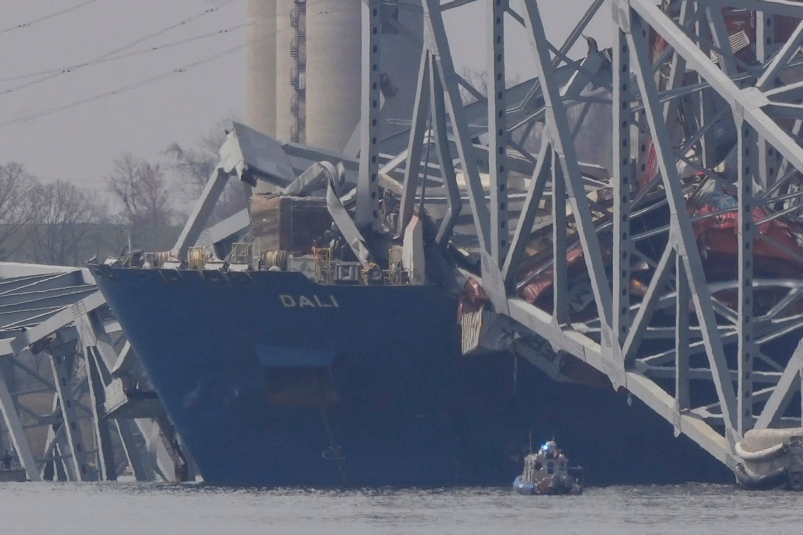 Baltimore bridge collapse: 2 bodies recovered, divers search for 4 ...