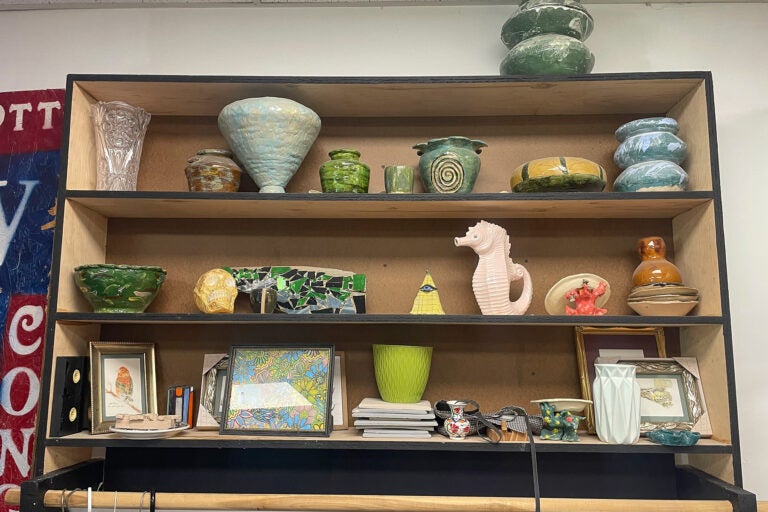 sculptures sitting on shelves