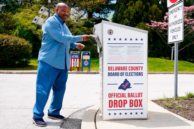 David Harrison drops off his mail ballot for the Pennsylvania primary election in Newtown Square, Pa., Monday, May 2, 2022.