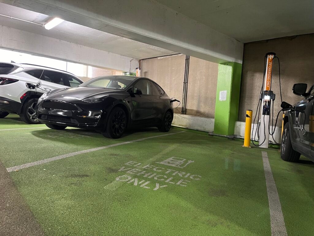 A car hooked up to a Level 2 charger in a Center City garage