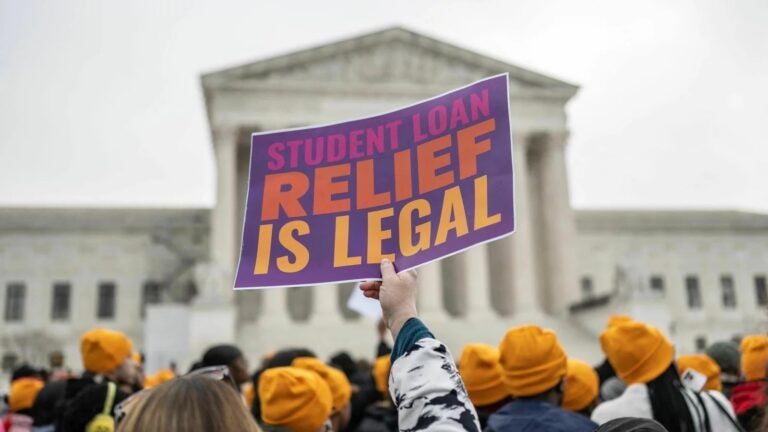 Activists and students protest in front of the Supreme Court during a rally for student debt cancellation in Washington, D.C.