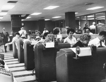 Employees of Goodbody & Co. work at the stock brokerage's headquarters in Manhattan, N.Y., circa 1965.
