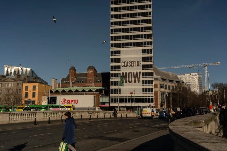 A large sign calling for a cease-fire in Gaza hangs from a building in Dublin