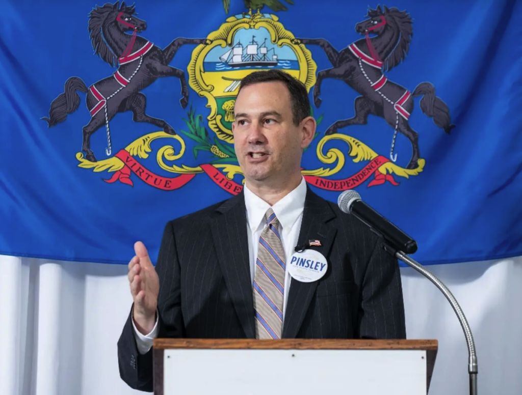 Mark Pinsley speaking at a podium