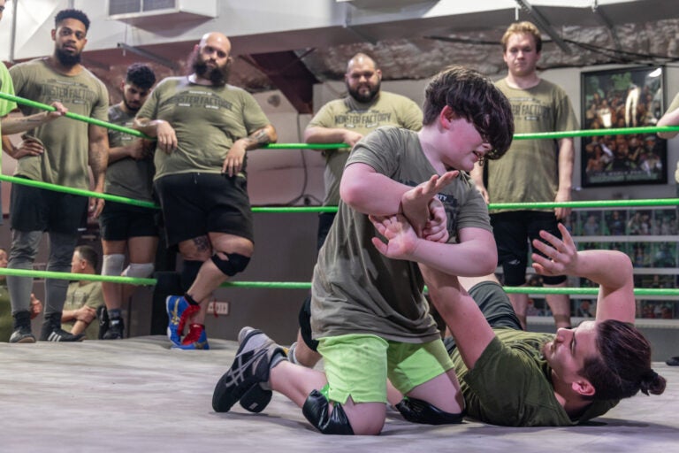 The motto of the Monster Factory, a wrestling gym in Paulsboro, N.J., is “wrestling is for everybody.” On Tuesday night, all ages of wrestlers gather to workout together. (Kimberly Paynter/WHYY)