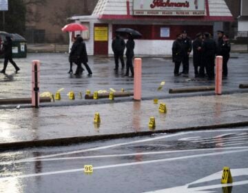 Evidence markers are seen following a shooting in Northeast Philadelphia on Wednesday, March 6, 2024.